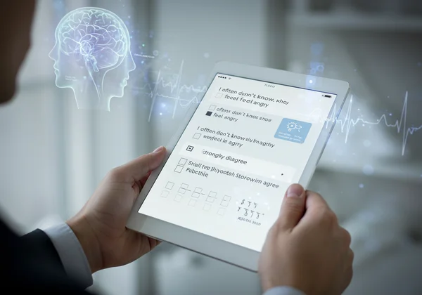 Alexithymia scale questions on a digital tablet.